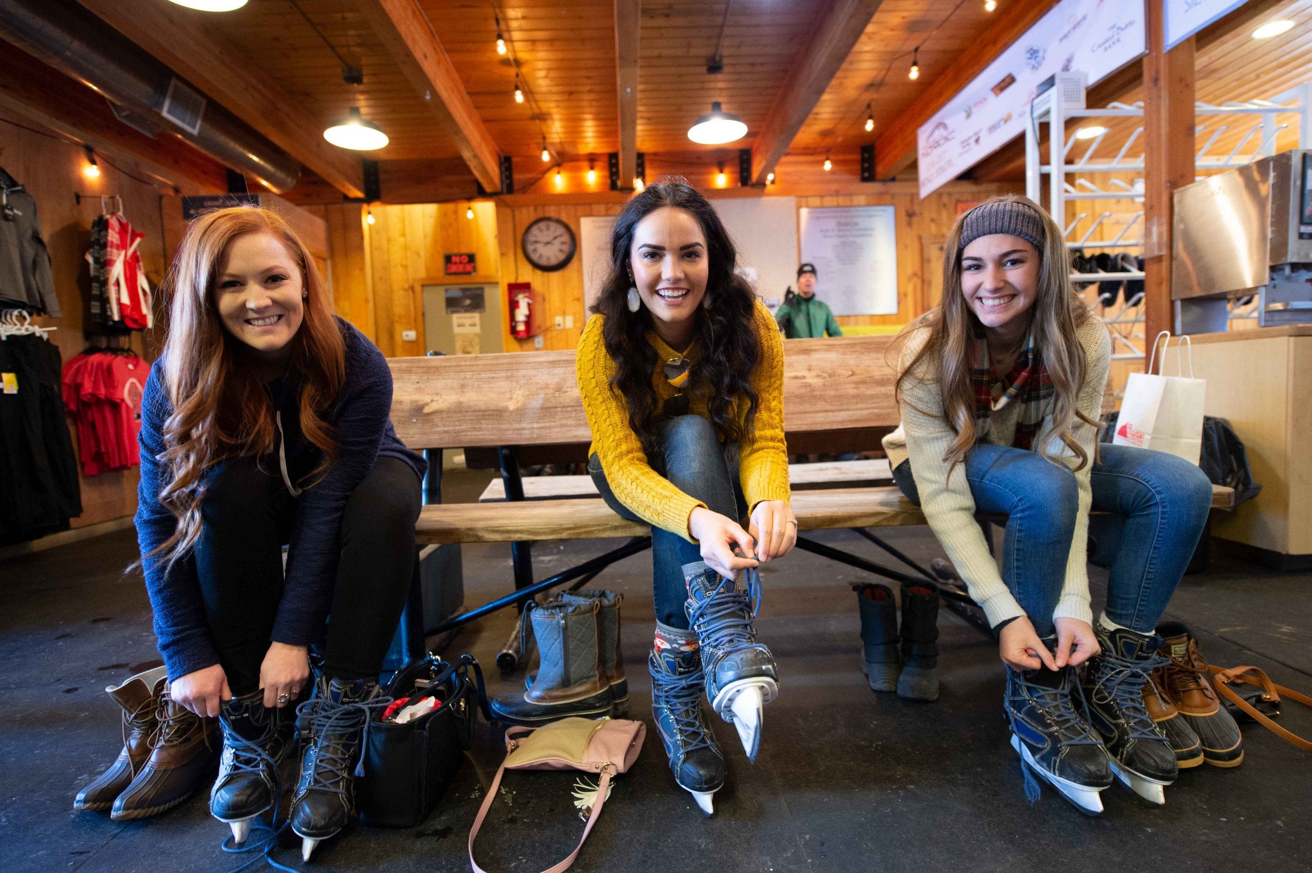 Girls Putting on Ice Skates