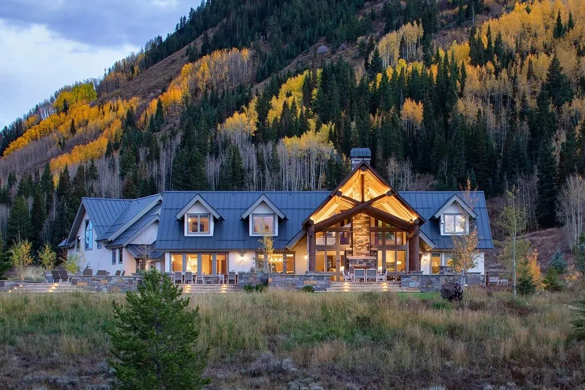 Panorama House exterior against golden aspens at dusk, above the Town of Crested Butte